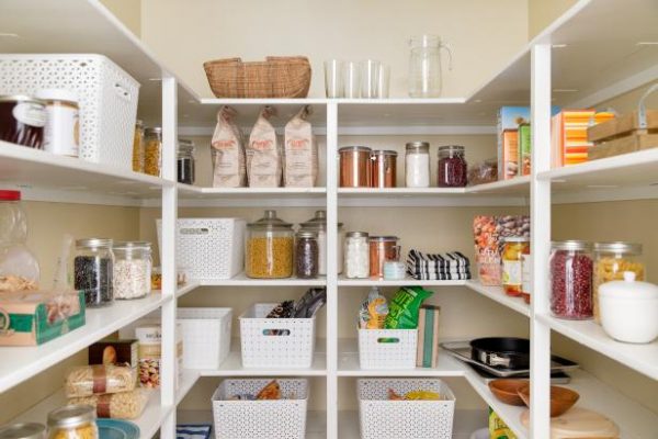 an organized kitchen pantry filled with food