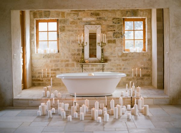 a stylish bathroom with ancient style walls